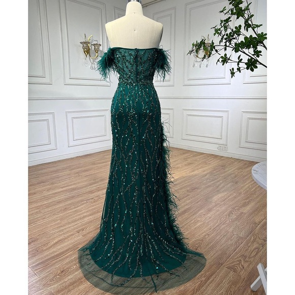 Emerald Off-the-shoulder mermaid dress with feather slit, sequins & short train. - Picture 2 of 5
